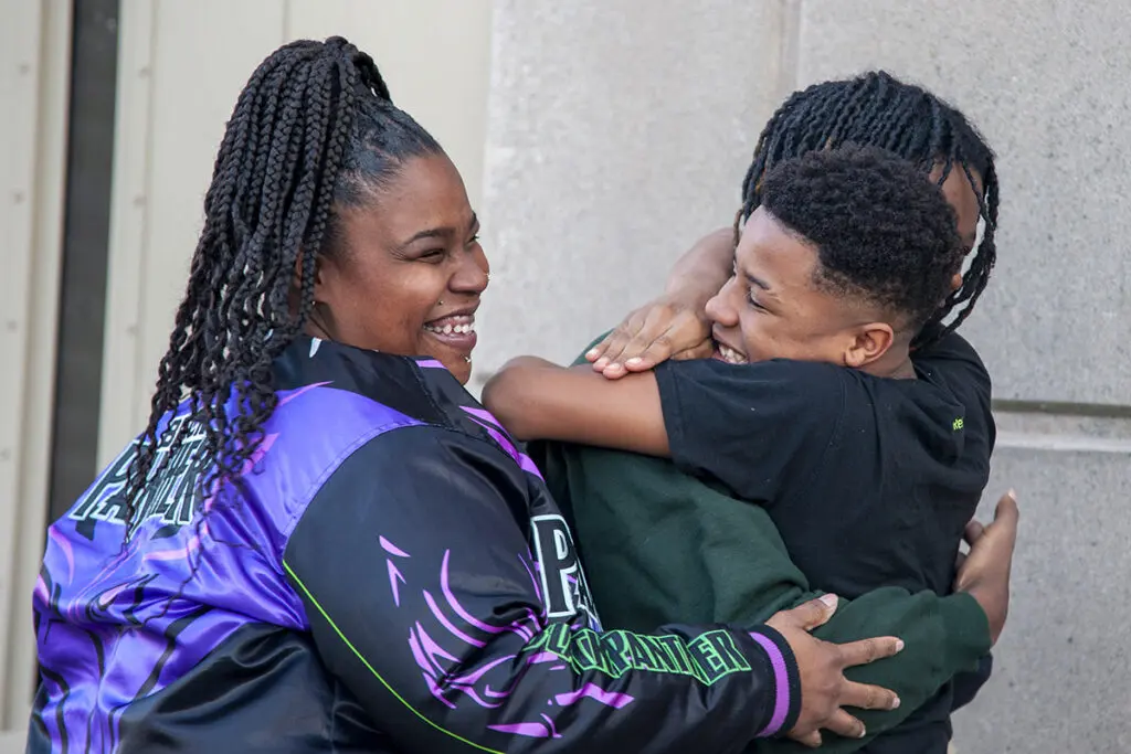 Carl Johnson client: Martel Lee Released from Jail Jennifer Jones, and Her Sons Cameron (12) and Martel Lee (16) (Photo by Keivn Mathewson)