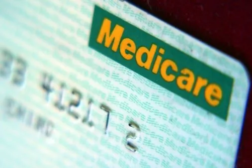Wisconsin Medicare fraud defense attorney reviewing billing-audit records