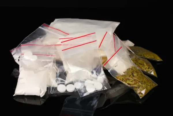 Wisconsin drug-charges defense attorney preparing a possession and distribution case